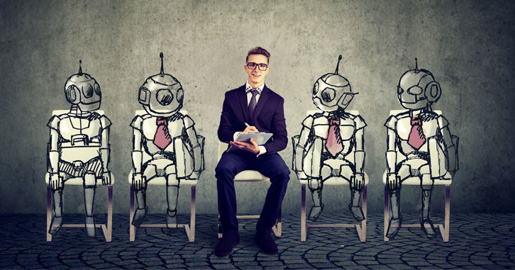 Man in suit sitting between robots in suits